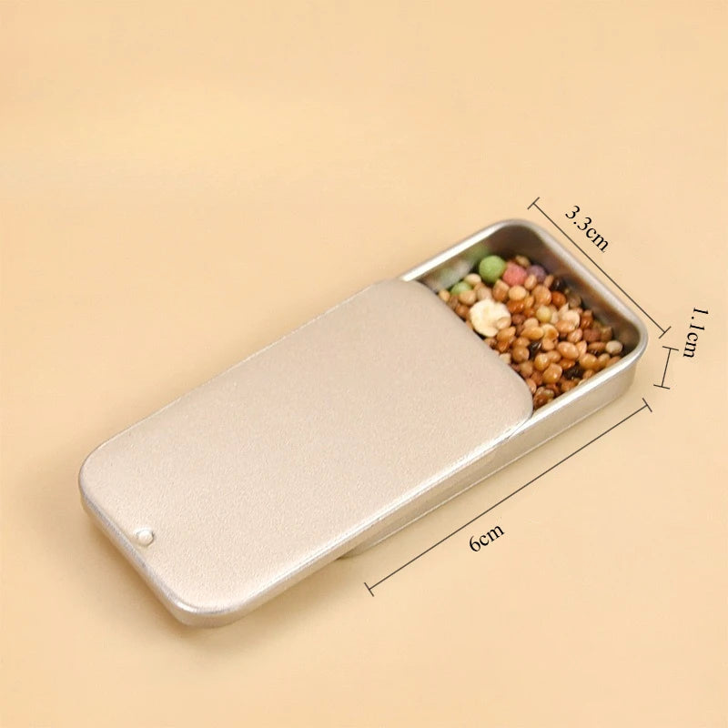 handhållen foderdosa i metall for fågelträning